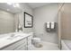 Clean bathroom with single vanity, shower/tub combo, and neutral color palette at 10937 Sw 73Rd Ct, Ocala, FL 34476