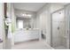 Spa-like bathroom with double vanity, a large shower, and modern fixtures at 10937 Sw 73Rd Ct, Ocala, FL 34476