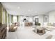 Open living and kitchen area with island and modern furniture at 10937 Sw 73Rd Ct, Ocala, FL 34476