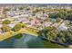 Aerial view showing a house's location in a residential area with a lake at 3722 Madbury Cir, Lakeland, FL 33810