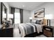 Bright bedroom with large window, dresser, and stylish bedding at 7416 Sw 107Th Ln, Ocala, FL 34476