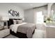 Spacious bedroom with a king-size bed and neutral decor at 7416 Sw 107Th Ln, Ocala, FL 34476