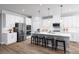 Modern kitchen with white cabinets, large island, and stainless steel appliances at 7416 Sw 107Th Ln, Ocala, FL 34476
