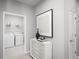 Convenient laundry room with washer, dryer, and shelving at 7416 Sw 107Th Ln, Ocala, FL 34476