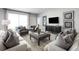 Living room with modern decor, cozy seating, and large TV at 7416 Sw 107Th Ln, Ocala, FL 34476