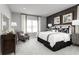 Relaxing main bedroom with a plush bed and accent chair at 7416 Sw 107Th Ln, Ocala, FL 34476