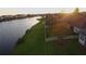 Aerial view showcasing lakefront property and white fence at 5631 Superior Dr, Lakeland, FL 33805