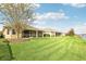 Landscaped backyard with lake view and spacious lawn at 5631 Superior Dr, Lakeland, FL 33805