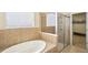 Bathroom boasts a soaking tub and a walk-in shower at 5631 Superior Dr, Lakeland, FL 33805