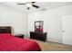 Bedroom with double bed, dresser, and ceiling fan at 5631 Superior Dr, Lakeland, FL 33805
