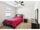 Bedroom with a double bed, nightstand, and dresser at 5631 Superior Dr, Lakeland, FL 33805