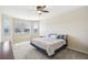 Main bedroom with water view, king bed, and ceiling fan at 5631 Superior Dr, Lakeland, FL 33805