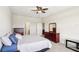 Main bedroom with king bed, dresser, and ceiling fan at 5631 Superior Dr, Lakeland, FL 33805