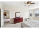 Bright bedroom with a dresser and a view of the kitchen at 5631 Superior Dr, Lakeland, FL 33805