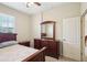 Bedroom with wood furniture and ceiling fan at 5631 Superior Dr, Lakeland, FL 33805