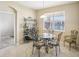 Bright breakfast nook with glass table and iron chairs at 5631 Superior Dr, Lakeland, FL 33805