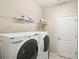 Laundry room with washer, dryer, and shelving at 5631 Superior Dr, Lakeland, FL 33805