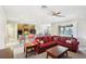 Living room with red sectional and view of kitchen and lake at 5631 Superior Dr, Lakeland, FL 33805