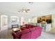 Open living room with red sectional sofa and kitchen view at 5631 Superior Dr, Lakeland, FL 33805