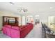 Living room with red sectional sofa and entertainment center at 5631 Superior Dr, Lakeland, FL 33805