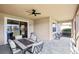 Relaxing screened lanai with table and chairs, offering a view of the lake at 5631 Superior Dr, Lakeland, FL 33805