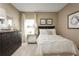 Small bedroom with a full-size bed and dark dresser at 1657 Laia Rd, Haines City, FL 33844