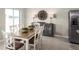 Bright dining room with table and chairs, adjacent to kitchen at 1657 Laia Rd, Haines City, FL 33844
