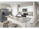 Modern kitchen with white cabinets and granite countertops at 1657 Laia Rd, Haines City, FL 33844