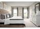 Spacious main bedroom with king-size bed and large windows at 1657 Laia Rd, Haines City, FL 33844