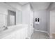 Clean bathroom with white cabinets and a large mirror at 1661 Laia Rd, Haines City, FL 33844