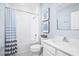 Bathroom with shower/tub combo and blue and white decor at 1661 Laia Rd, Haines City, FL 33844