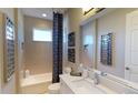 Clean bathroom with a bathtub and stylish finishes at 1341 Arklow Cir, Ormond Beach, FL 32174