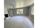 Living room with tile floors and a fireplace at 1500 32Nd Nw St, Winter Haven, FL 33881