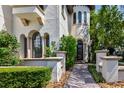 Mediterranean-style home with arched entryway and manicured landscaping at 779 Stephens Pass Cv, Lake Mary, FL 32746