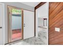 Bright entryway with a view to the living area and access to a patio at 1502 Ne Buckeye Ne Rd # 2, Winter Haven, FL 33881