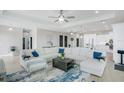 Spacious living area with sectional sofa, large windows, and open kitchen at 31 Seabridge Dr, Ormond Beach, FL 32176