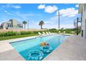 Inviting pool with floating inflatables, perfect for relaxation at 31 Seabridge Dr, Ormond Beach, FL 32176