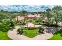 Luxury lakefront home with circular driveway at 13352 Lago Vista Dr, Winter Garden, FL 34787