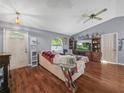 Living room with hardwood floors and a cozy seating area at 5337 Jacob Ave, Polk City, FL 33868