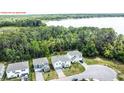 Aerial view of house and surrounding landscape at 29912 Cypress Pointe, Deer Island, FL 32778