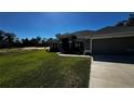 One-story home with gray exterior and landscaped yard at 9832 Sw 46Th Ct, Ocala, FL 34476