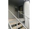 Condo building entryway with stairs and address number 2402 at 2402 Lemon Tree Ln # 1-E, Orlando, FL 32839