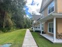 Sidewalk leading to townhouses nestled in lush greenery at 4005 Santa Maria Dr # 103, Kissimmee, FL 34741