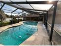 Inviting swimming pool with a screened enclosure at 4422 Meadowood St, Orlando, FL 32812