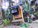 Electrical box mounted on a wooden post at 891 Michigan St, Sanford, FL 32773