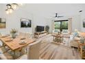 Bright living room with hardwood floors and stylish furniture at 3800 Saxon Dr # C-52, New Smyrna Beach, FL 32169