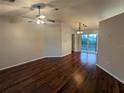 Spacious living room with hardwood floors and access to a patio at 6059 Magpie Dr, Lakeland, FL 33809
