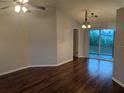 Spacious living room with hardwood floors and access to a patio at 6059 Magpie Dr, Lakeland, FL 33809