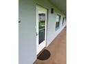 Inviting condo entrance with a glass door and doormat at 333 Lake Howard Nw Dr # 202C, Winter Haven, FL 33880