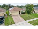 One-story house with solar panels and a brick driveway at 4814 Rockvale Dr, Kissimmee, FL 34758